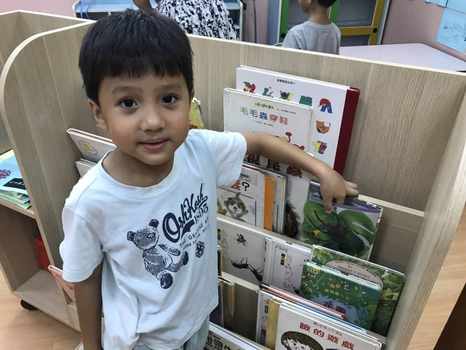 child at book rack homeschooling